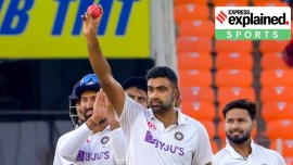 R Ashwin reacts on completing 400 Test wicket with an arm raised up.