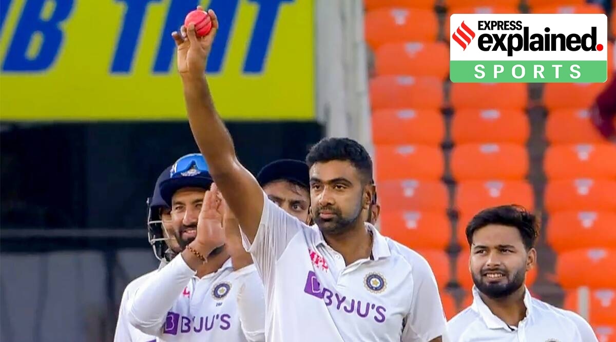 R Ashwin reacts on completing 400 Test wicket with an arm raised up.
