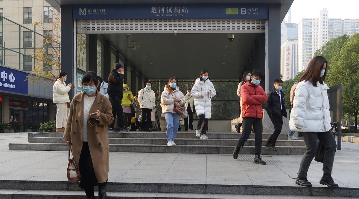 People walk out of a subway station during morning rush hour in Wuchang district, after the government gradually loosened the restrictions on coronavirus disease (COVID-19) control, in Wuhan, Hubei province, China December 9, 2022. (Reuters)