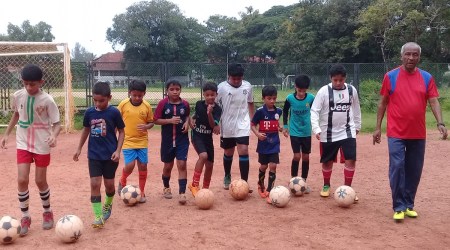 Football coach Rufus D’Souza with his students. (Express photo)