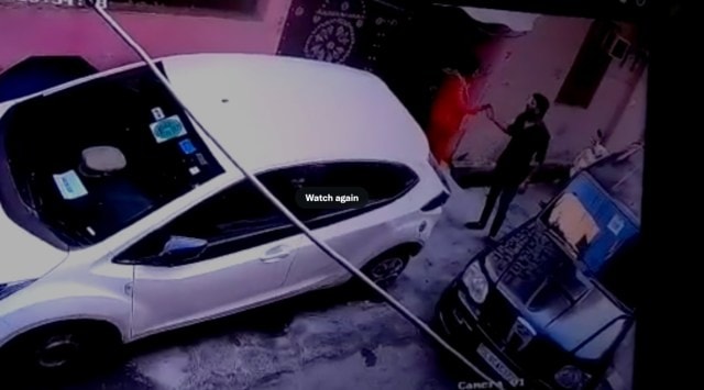 In the video, the man is seen entering the lane and hitting a car with his black SUV. The complainant comes out and starts arguing with him. Both are seen fighting as she takes out the side view mirror of his car. (Screenshot)
