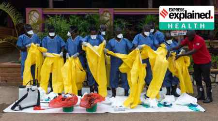 Volunteers received training on how to conduct safe and dignified burials for Ebola victims in Mubende, Uganda, in October. (Luke Dray/Getty Images/New York Times)