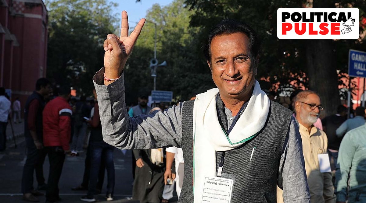 Congress MLA from Jamalpur-Khadia assembly seat Imran Khedawala shows victory sign outside counting centre in Ahmedabadad. (Express photo by Nirmal Harindran)