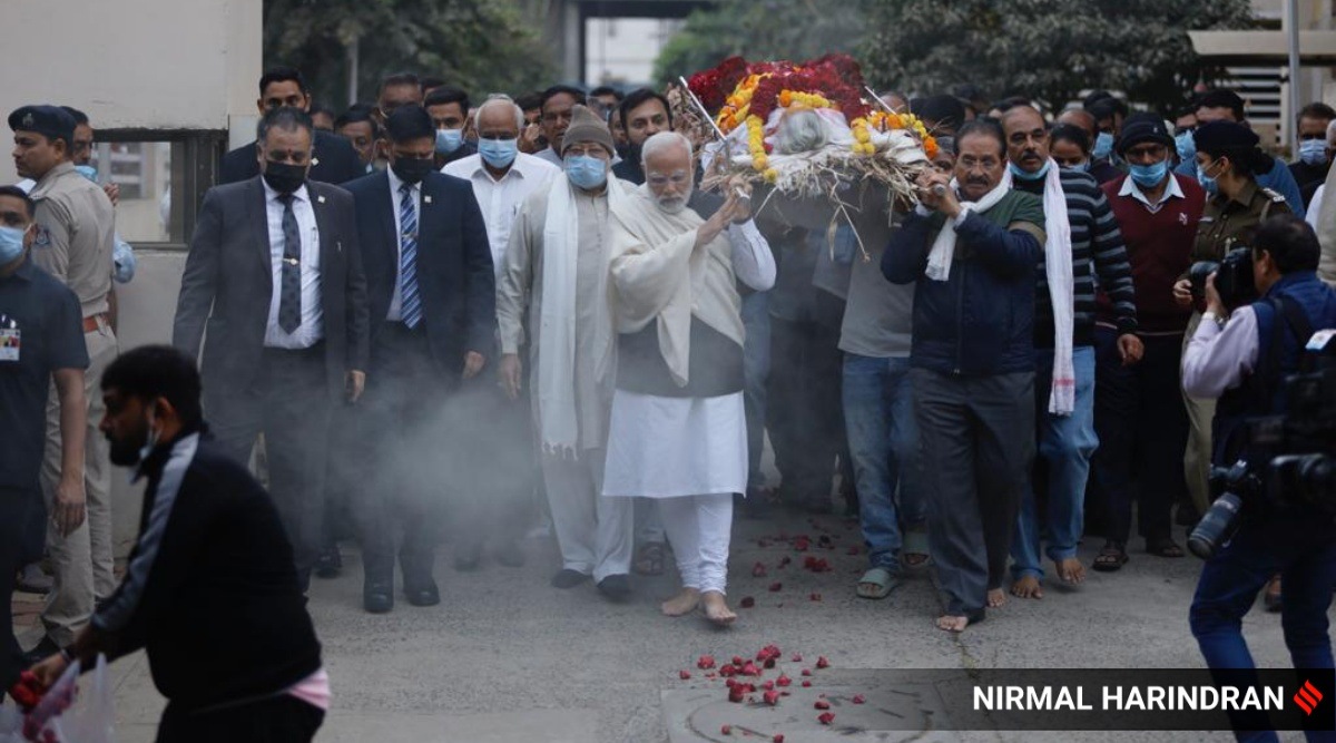 PM Narendra Modi with the mortal remains of his mother. (Express photo by Nirmal Harindran)