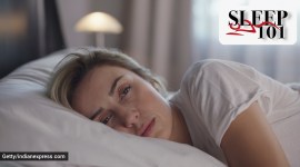 Beautiful woman sleeping peacefully in her bed. Woman wakes up and stretches. sleep 101