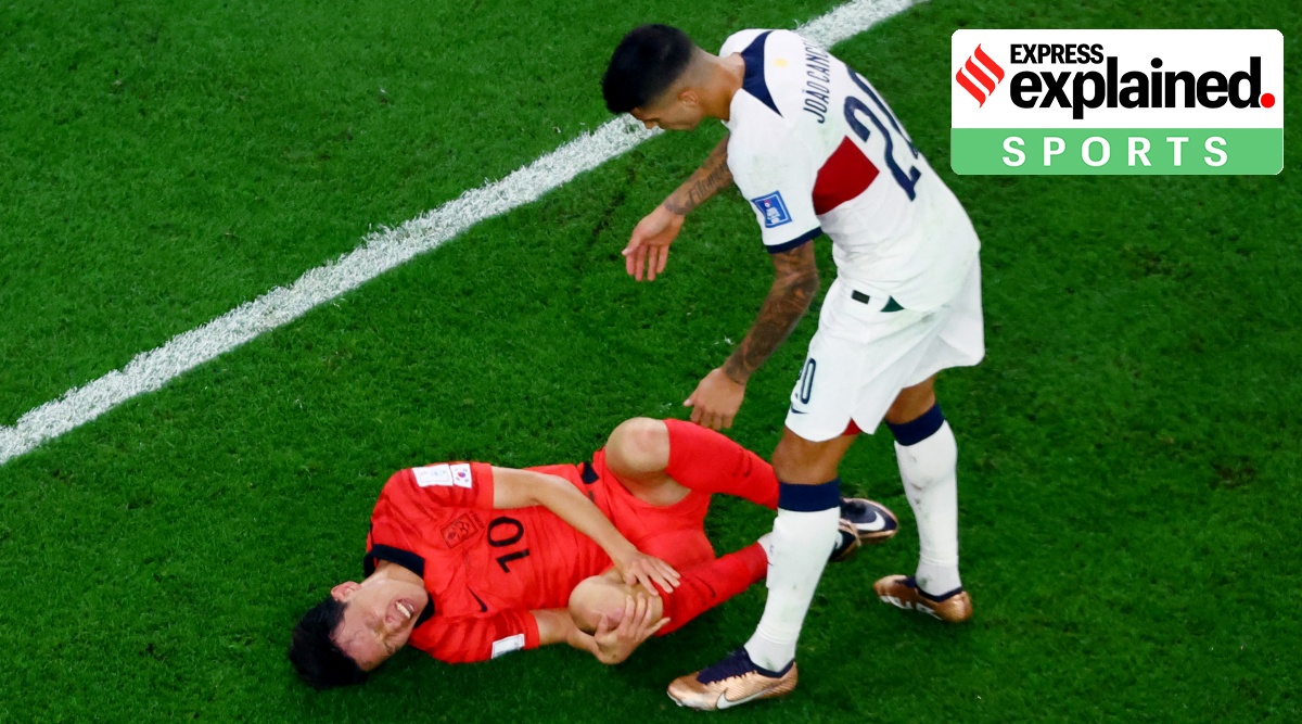 South Korea's Lee Jae-sung sustains an injury as Portugal's Joao Cancelo looks on.
