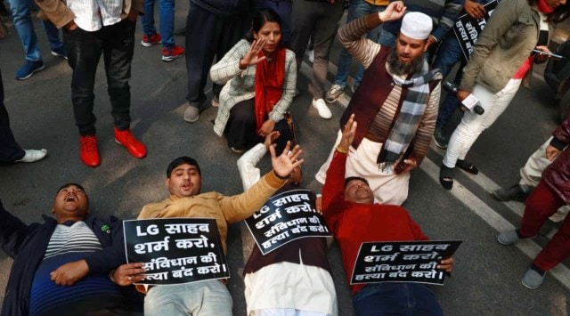 Aam Aadmi Party (AAP) councillors and legislator during a sit-in at  outside Lieutenant Governor Vinai Kumar Saxena’s office in New Delhi. (Express photo By Amit Mehra)