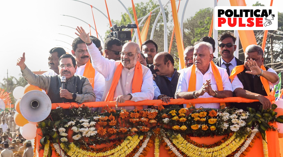 Union Home Minister Amit Shah with Union Minister Pralhad Joshi, Karnataka Chief Minister Basavaraj Bommai and former CM B S Yediyurappa during a road show, at Kundgol in Karnataka's Dharwad district. (PTI)