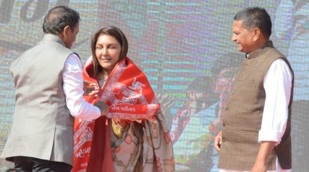 Anar Patel, a businesswoman and a social worker, was formally welcomed to the trust by SKT president Naresh Patel and trustee Chhagan Busa by offering her a scarf of the temple in the presence of CM Bhupendra Patel. (Express photo)
