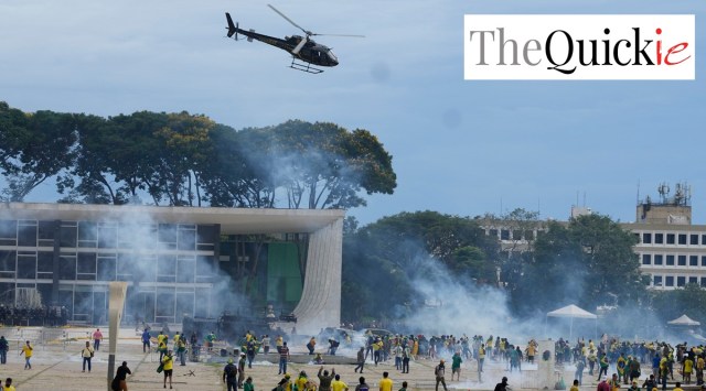 A helicopter flies overhead smoke and Protesters, supporters of Brazil's former President Jair Bolsonaro, clash with police as they storm the Planalto Palace in Brasilia, Brazil,