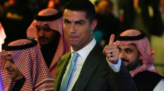 Cristiano Ronaldoreacts during his official unveiling as a new member of Al Nassr soccer club in in Riyadh, Saudi Arabia, Tuesday, Jan. 3, 2023.Ronaldo, who has won five Ballon d'Ors awards for the best soccer player in the world and five Champions League titles, will play outside of Europe for the first time in his storied career. (AP Photo/Amr Nabil)