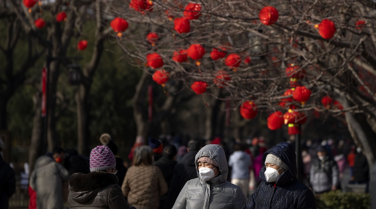 Chinese pray for health in Lunar New Year as Covid death toll rises