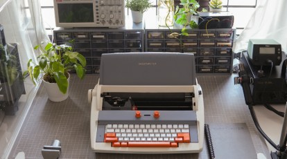 Boy Typing On Old Typewriter Stock Photo - Download Image Now