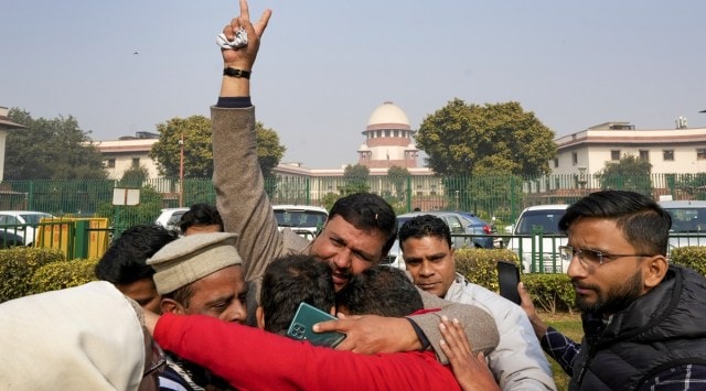 Haldwani residents celebrate the Supreme Court order, in New Delhi on Thursday. (PTI)