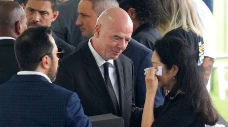 FIFA President Gianni Infantino gives his condolences to Marcia Aoki, the widow of Brazilian soccer great Pele, during the wake at Vila Belmiro stadium in Santos, Brazil, Monday, Jan. 2, 2023. (AP Photo/Andre Penner)