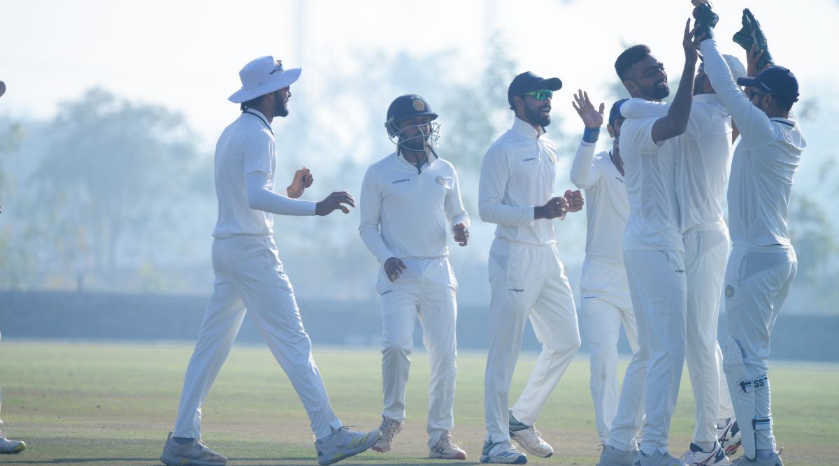 Jaydev Unadkat (third from right) celebrates with his Saurashtra teammates after claiming a wicket during a Ranji match against Delhi, at Saurashtra Cricket Association Stadium, in Rajkot on Tuesday. (Express Photo)
