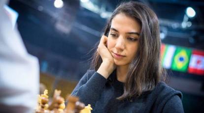 woman studying the next chess move, Stock image