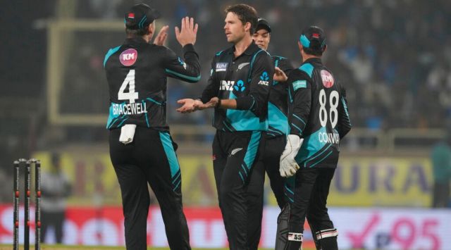 New Zealand's Lockie Ferguson, center, celebrate the wicket of India's Kuldeep Yadav with his teammates during the first Twenty20 cricket match between between India and New Zealand in Ranchi, India, Friday, Jan. 27, 2023. (AP Photo/Bikas Das)