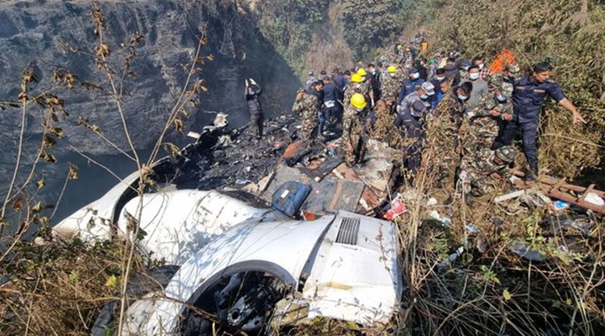 Rescue teams work to retrieve bodies at the crash site of an aircraft carrying 72 people in Pokhara in western Nepal January 15, 2023. (Bijay Neupane/Handout via REUTERS)