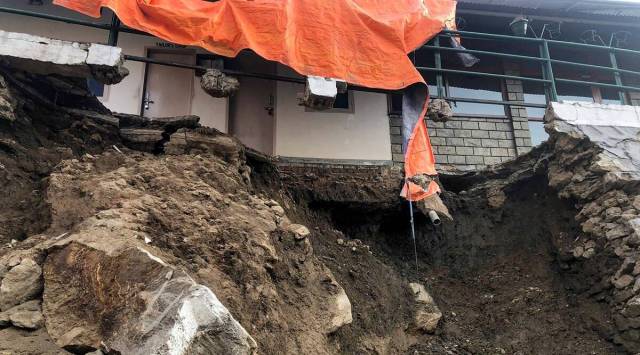 A collapsed part of a house due to landslides at Joshimath in the Chamoli district of Uttarakhand. (PTI)