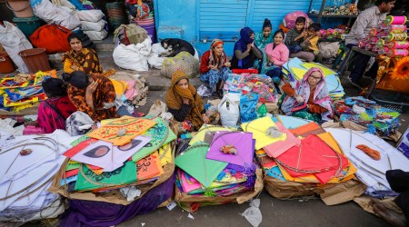 Roadside kite sellers wait for customers ahead of the Makar Sankranti festival, in Ahmedabad, January 13, 2023. (PTI)