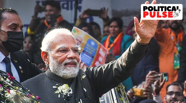 Prime Minister Narendra Modi waves at supporters during a roadshow, in New Delhi. (PTI Photo)