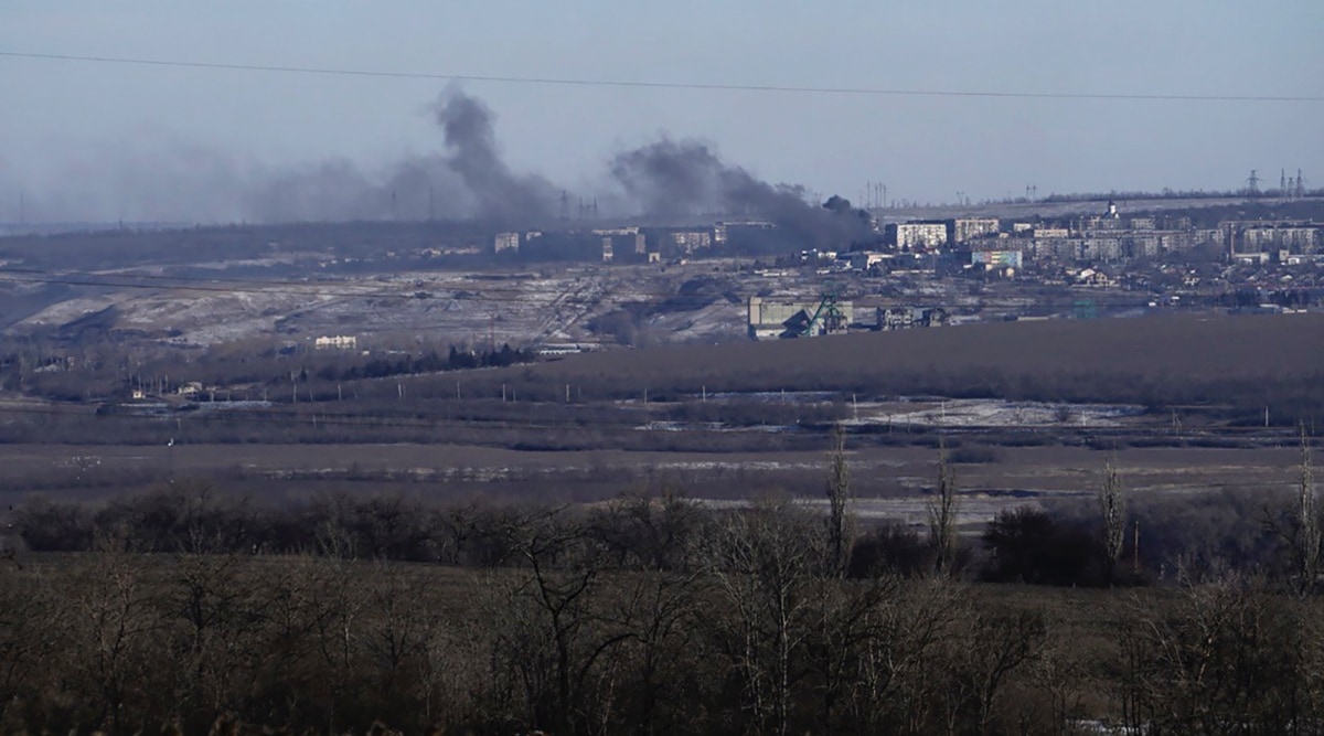 Smoke billows during fighting between Ukrainian and Russian forces in Soledar, Donetsk region, Ukraine, Wednesday, Jan. 11, 2023. (AP Photo/Libkos)
