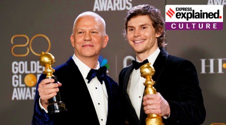Ryan Murphy, left, winner of the Carol Burnett award, and Evan Peters, winner of the award for best performance by an actor in a limited series, anthology series, or a motion picture made for television for "Dahmer - Monster: The Jeffrey Dahmer Story," pose in the press room at the 80th annual Golden Globe Awards on Jan. 10.