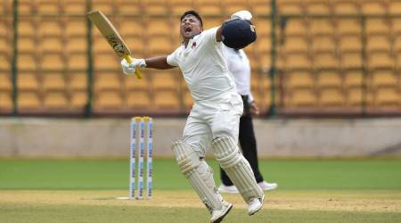 Sarfaraz Khan celebrates after scoring a century in the Ranji Trophy.
