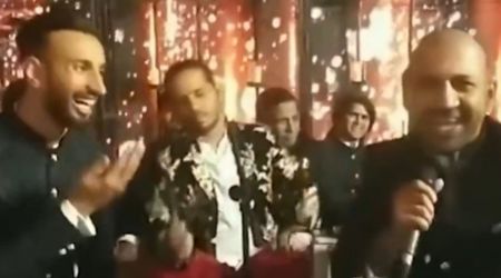 Screengrab: Sarfaraz Ahmed (right) singing at Shan Masood's wedding ceremony. (ARY News)