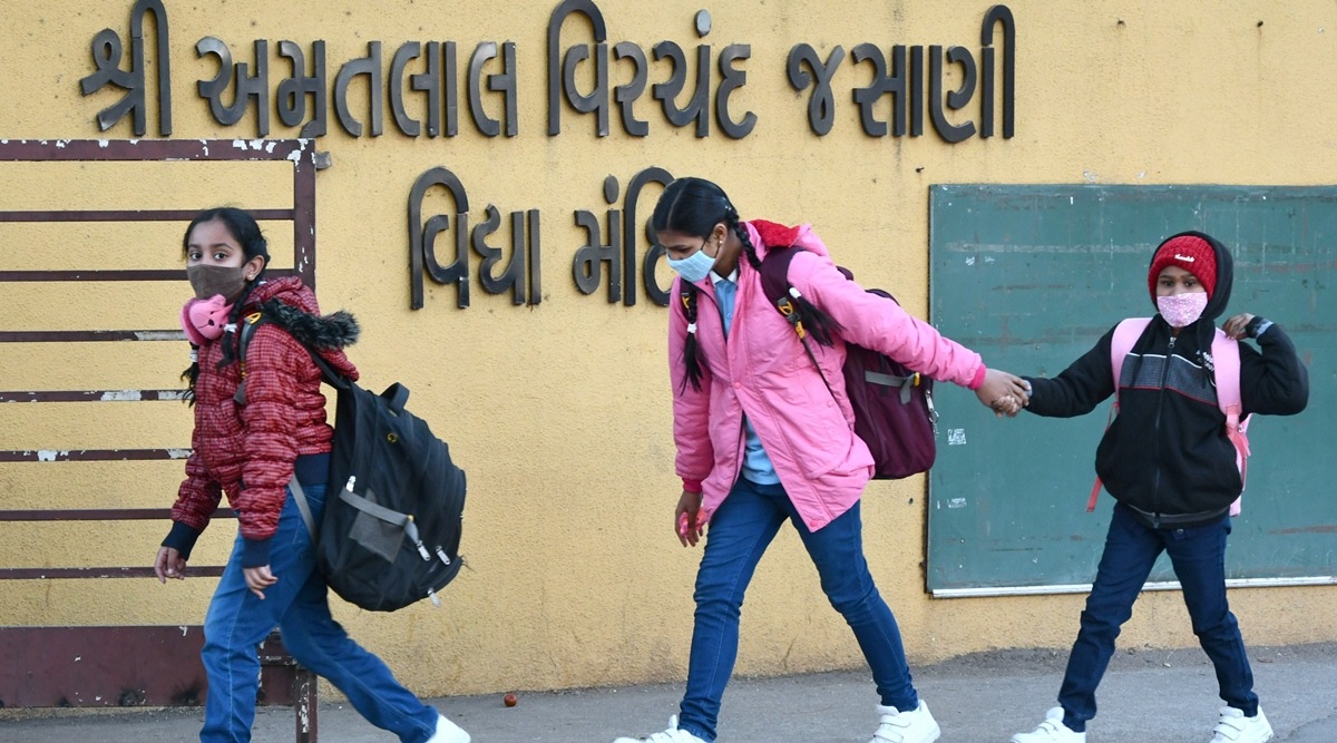 Students arrive at Amrutlal Virchand Jasani Vidyamandir in Rajkot on Thursday. (Express Photo)