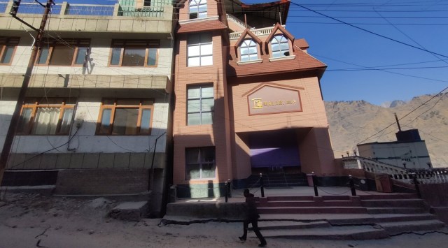 Two hotels have been closed after one building was found to have tilted towards the other, in Joshimath. (Express photo by Avaneesh Mishra)