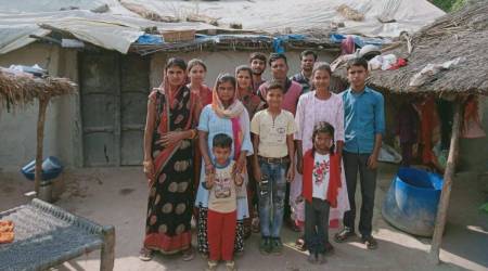 India Under-19 women's World Cup team member Archana Devi's mother Savitri (left) with family members in front of their house in Ratai Purwa village, Unnao. (Image Credit: Via arrangement)