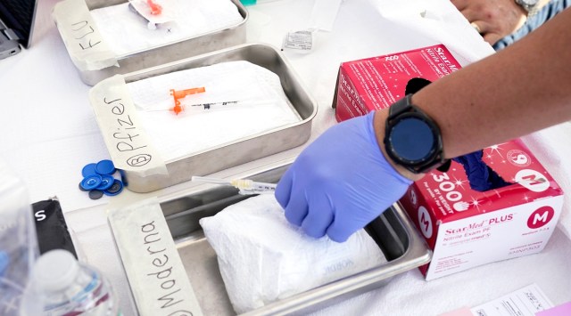 Syringes with vaccines are prepared at the LA Care and Blue Shield of California Promise Health Plans' Community Resource Center where they were offering members and the public free flu and Covid-19 vaccines, Oct. 28, 2022, in Lynwood, California.  (AP)