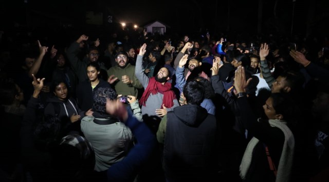 JNU students protest at the campus main gate. (Express Photo by Amit Mehra)
