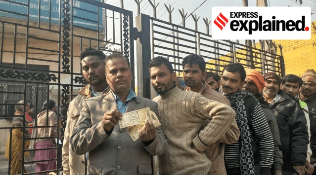 File photo of a labourer showing Rs 500 currency notes to be deposited in a bank in Ludhiana on December 27, 2016. (Express photo)