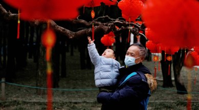 father and baby enjoy lunar year celebrations in china