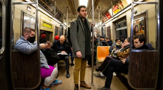 Brian Teitelbaum, 28, a project manager in New York, rides a subway train home at the end of the day on Jan. 10, 2023. Teitelbaum has no student debt and saves about $2,000 a month. (Desiree Rios/The New York Times)