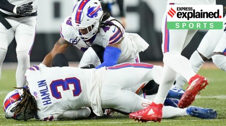 Buffalo Bills safety Damar Hamlin (3) lies on the turf after making a tackle on Cincinnati Bengals wide receiver Tee Higgins, blocked from view, as Buffalo Bills linebacker Tremaine Edmunds (49) assists at the end of the play during the first half of an NFL football game between the Cincinnati Bengals and the Buffalo Bills, Monday, Jan. 2, 2023. (AP Photo)