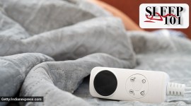 controller of an electric blanket with a human sleeping at the background at horizontal composition electric blanket, sleep 101