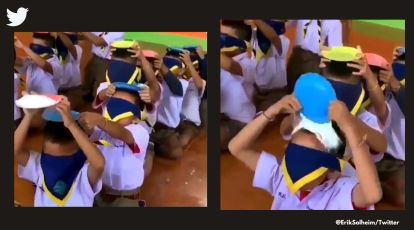 Boys pass plates of flour over their head; hilarious game leaves netizens amused | Trending News,The Indian Express Boys pass plates of flour over their head; hilarious game leaves netizens amused | Trending News,The Indian Express