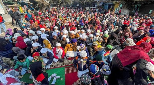 Residents stage a dharna ahead of the Supreme Court order on the plea opposing their imminent eviction, in Haldwani, Thursday, Jan. 5, 2022. (PTI Photo)
