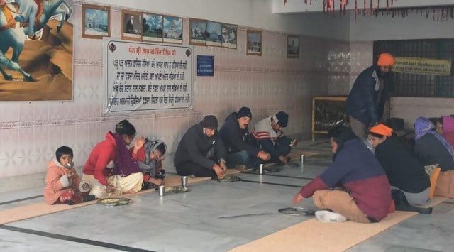 Affected families having Langar at Gurudwara Joshimath.  (Express Photo)