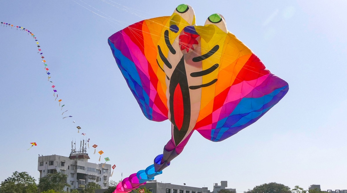 People fly kites during International Kite Festival 2023, in Rajkot