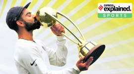 Virat Kohli kissing the Border Gavaskar Trophy.