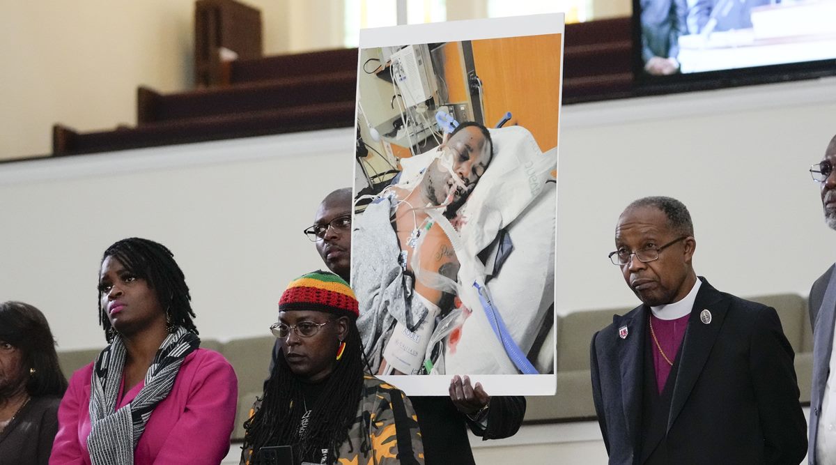 Family members and supporters hold a photograph of Tyre Nichols at a news conference in Memphis, Tenn., Jan. 23, 2023. (AP Photo/Gerald Herbert, file)