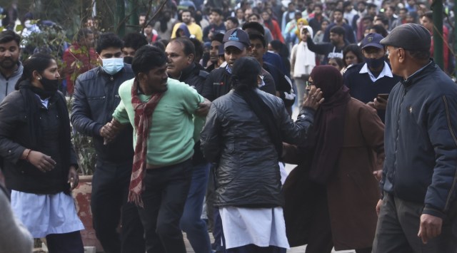 DU’s security personnel face off with students inside the Arts Faculty, Friday. (Express Photo by Amit Mehra)