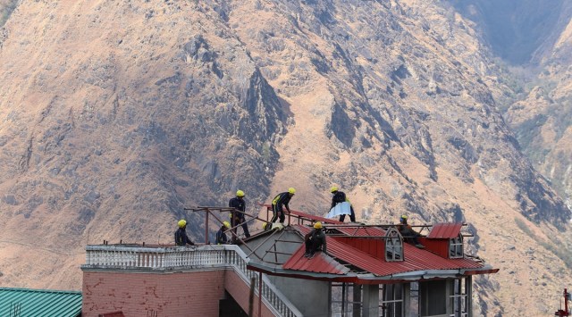 Workers demolish a Joshimath hotel on Friday. Reuters