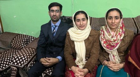 (From left) Suhail Ahmad Wani with sisters Huma and Ifra at their home in Shahbad Colony in Jammu. Express 