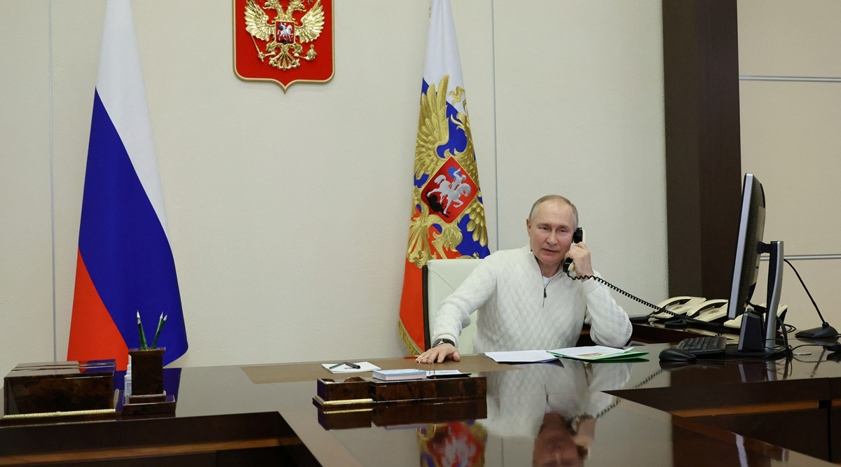 Russian President Vladimir Putin speaks on the phone with David Shmelev from Stavropol Region, a 7-year-old participant of a New Year's and Christmas charity event, at the Novo-Ogaryovo state residence outside Moscow, Russia January 5, 2023. (Reuters)
